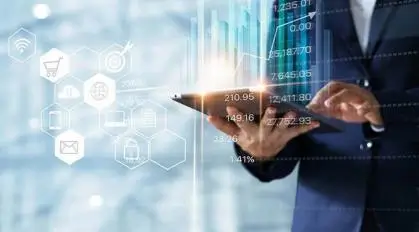 Person using a tablet with digital graphs and icons overlay.